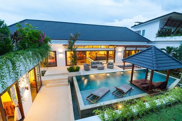 A modern island villa with open living room, swimming pool, gazebo
